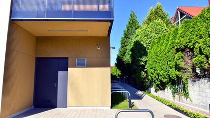 European residential architecture harmonizing with nature. Eco-friendly living in city with greens....