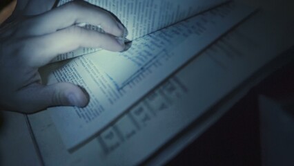 The man with the lantern reading a book
