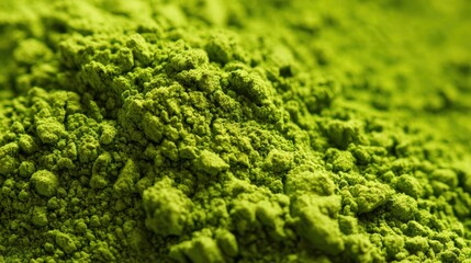 Close-up of vibrant green powder texture, perfect for culinary or health-related projects and visual storytelling.