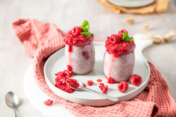 Raspberry chia seed pudding in glass jars