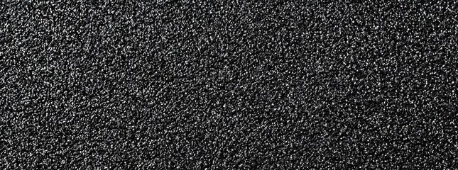 Obraz premium Dark gray textured surface with small, uneven granules