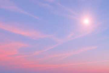 Obraz premium Soft pastel-colored sky with gentle clouds and sun flare. Ideal for serene, dreamlike, or inspirational nature backgrounds and peaceful outdoor visuals.