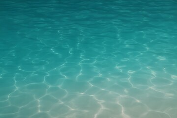 Obraz premium Clear turquoise sea water with sunlit ripples and soft waves—tropical background for travel promos, summer banners, spa and wellness design, social headers and beach concepts. 