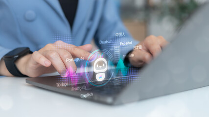 Businesswoman using a laptop with an AI chatbot and multilingual translation technology, concept of...