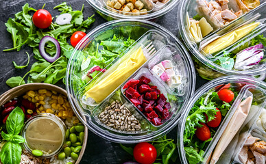Round plastic boxes with pre-packaged vegetable salads