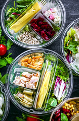 Round plastic boxes with pre-packaged vegetable salads