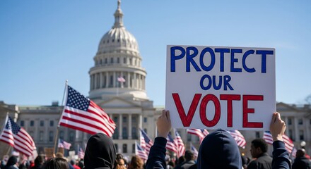 People gather in front of the U.S. Capitol building, holding American flags and a sign that reads 'PROTECT OUR VOTE', during a demonstration.