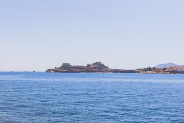 Panoramic view of historic fortress island surrounded by crystal blue Mediterranean waters,...