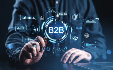 Business-to-business B2B digital strategy concept with futuristic data interface and analytics icons on dark blue background with businessman interaction.