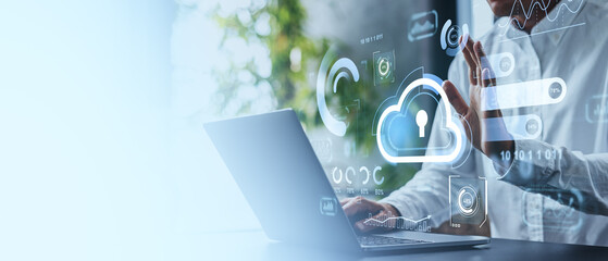 Man interacting with cloud technology interface on laptop in mod