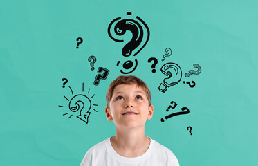Curious kid looking up with question marks on turquoise backgrou