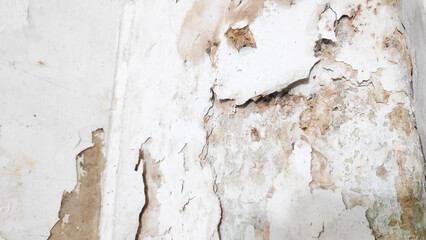 The dirty wall has a thick layer of grime buildup