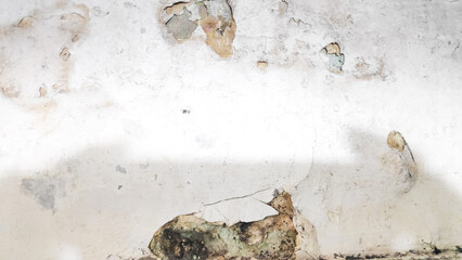 The paint is bubbling and blistering due to moisture.