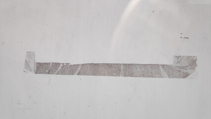 The old store's door has old adhesive tape residue left.