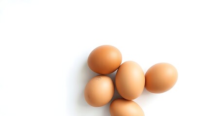 Simple composition of brown eggs on a pure white background, highlighting natural beauty.