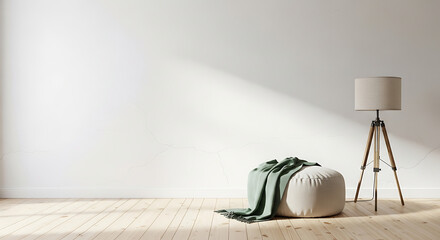 Minimalist interior design with a beige pouf and tripod lamp.