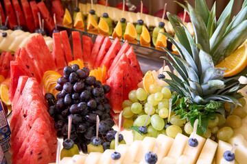 Vibrant fruit display featuring a colorful array of fresh tropical delights at a summer celebration...