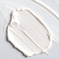 Creamy white substance smudged on a gray surface (1)