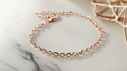 Obraz premium Modern minimalistic anklet in rose gold with a simple chain design displayed on a marble background highlighting understated elegance that suits a contemporary fashion taste