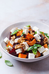 Salad with sweet potato, beetroot, feta and walnuts.