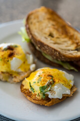 Delicious plate of eggs Benedict on a white dish