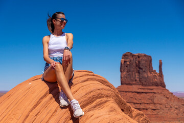 Young Woman in White Shirt and Shorts at Stagecoach Formations in Utah, USA