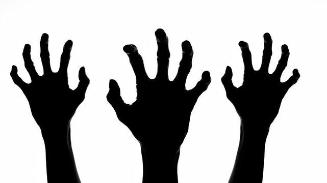 Three Scary Zombie Hands Reaching Up Silhouette Animation.