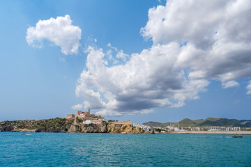 Scenic Coastal View with Historic Castle Under Blue Sky. Eivissa, Ibiza, Spain.