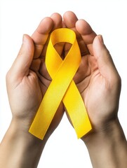 hands holding a yellow ribbon symbol of hope and support isolated on transparent background
