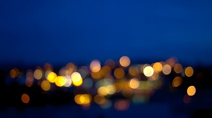 Abstract city light bokeh in deep blue tones, evoking the atmospheric glow of an urban nightscape.