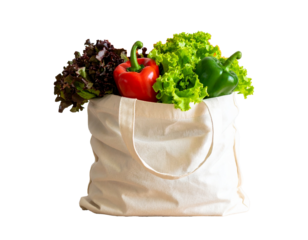 Fresh organic vegetables in reusable cloth bag isolated