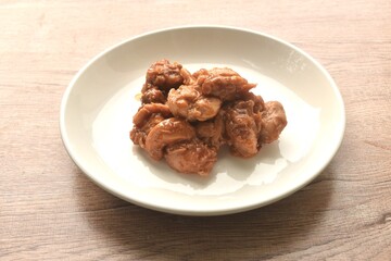 baking slice chicken meat with sweet and sour sauce on plate