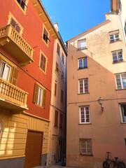 Fototapeta premium Old street in Italian countryside near sea. Traditional building. Sun day. Entrance, window to house. Nature and sky.
