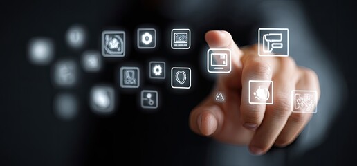 Hand interacting with a holographic interface displaying various app icons