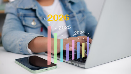 Business growth forecast 2024 to 2026, laptop with bar chart and line graph, financial planning and...