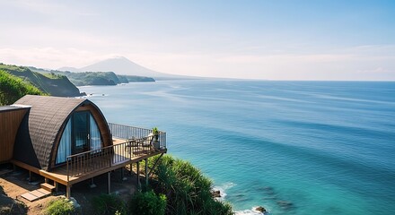 Breathtaking cliffside pod villa offering panoramic views of the crystal-clear ocean, lush coastline, and a distant volcano. Ideal for a luxury tropical escape.