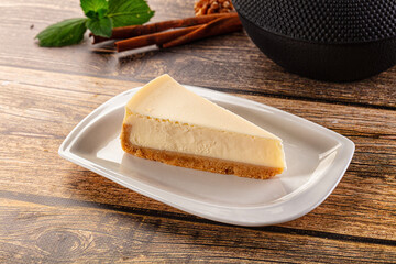 Classic delicous cheesecake slice served mint