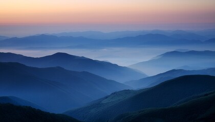 Fototapeta premium serene mountain landscape with soft layered hills fading into the distance under a misty twilight sky
