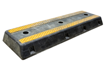 Black rubber parking block with yellow reflective stripes isolated with transparent background