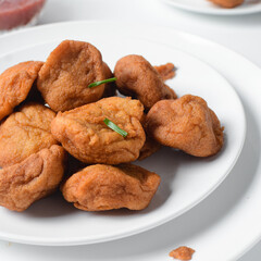 Overhead view of Akara on a white plate, top view of Brazilian acaraje fried beans cake on a plate