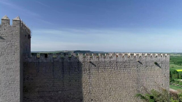 Aerial photo of Monzon de Campos Castle surrounded by green rural fields