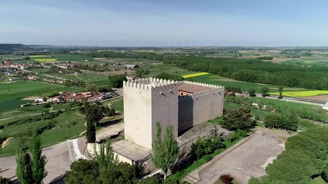 Aerial photo of Monzon de Campos Castle surrounded by green rural fields