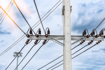 A large high-voltage electric pole with a beautiful sky in the background, electric wires, high...