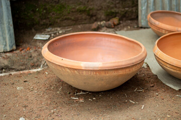Terracotta pot with a wide opening and textured exterior