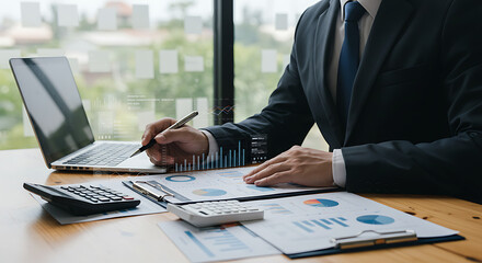 Financial Analysis Focus: An executive meticulously analyzes financial data on a wooden desk in a modern office, surrounded by graphs and a calculator, highlighting the precision of business