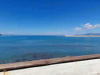 Obraz premium Clear Blue Sea View with Distant Lighthouse