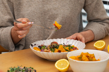 Healthy eating concept with pumpkin salad on wooden table. Autumn salad. 