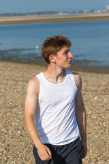Teenage Boy Walking Beach