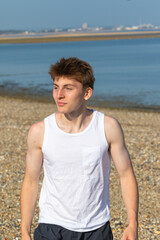 Teenage Boy Walking Beach