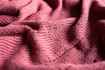 pink wool knitted fabric texture textile close up clothing background